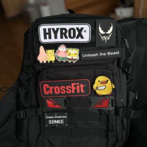 Hyrox backpack with example patches on MOLLE patch strip, patches not included